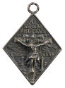 Silver medal depicting the Crucifixion superimposed over a double-headed eagle