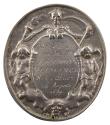 Silver medal of a skeleton, crowned with laurels, holding a scythe in one hand and a flaming to…