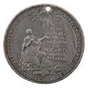 Silver medal depicting a kneeling woman wearing a mantel and looking up toward a radiant triang…