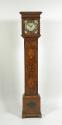 Front view of longcase clock showing marqueted vegetal motifs