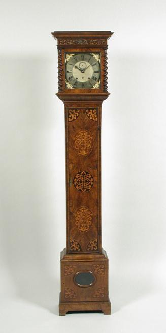 Front view of longcase clock showing marqueted vegetal motifs