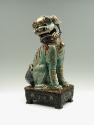 Side view of green porcelain lion