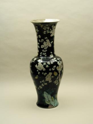 Black ground porcelain vase with branches and white flowers