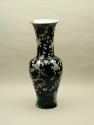 Base of black ground porcelain vase with branches and white flowers