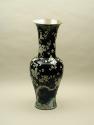 Base of black ground porcelain vase with branches and white flowers