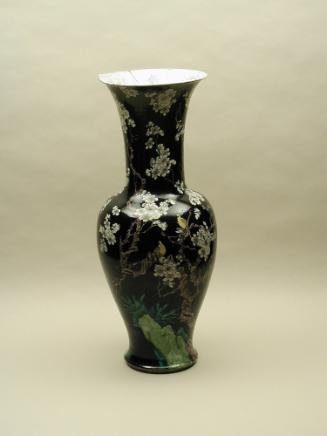 Black ground porcelain vase with branches and white flowers