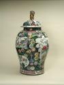 Alternate view of large porcelain covered jar with famille rose decoration and black ground sur…