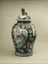 Alternate view of large porcelain covered jar with famille rose decoration and black ground sur…