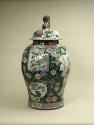 Alternate view of large porcelain covered jar with famille rose decoration and black ground sur…