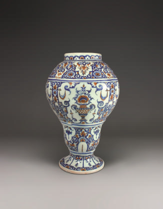 Small vase with ornate decoration in blue and red