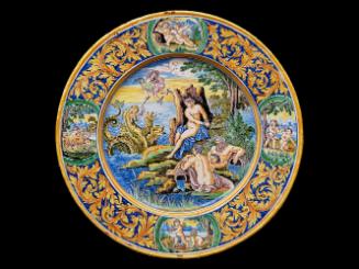 Large circular plate with a mythological scene and ornate border, in color 