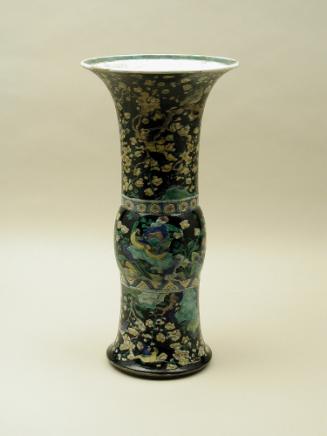 Porcelain vase in bronze form with black ground and floral and vegetal designs