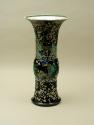 Alternate view of porcelain vase in bronze form with black ground and floral and vegetal design…