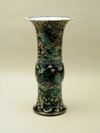 Porcelain vase in bronze form with black ground and floral and vegetal designs