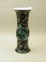 Alternate view of porcelain vase in bronze form with black ground and floral and vegetal design…