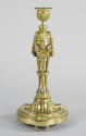 Gilt bronze candlestick with cherub heads and swags of garland