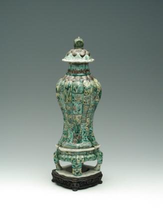 Green porcelain jar with floral and vegetal designs