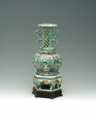 Green porcelain jar with handles and floral and vegetal designs