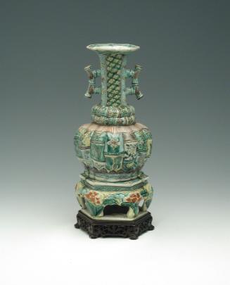 Green porcelain jar with handles and floral and vegetal designs