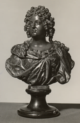 Bronze sculpture of the bust of a woman with curled hair