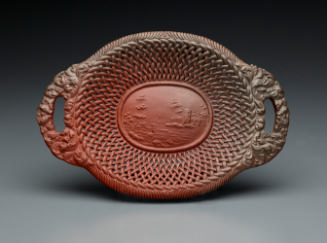 Brown, oval-shaped basket with handles