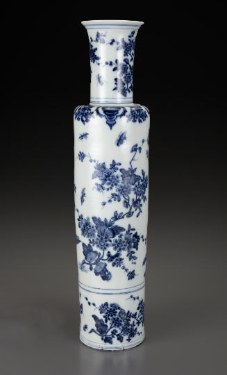 Tall vase with blue floral decoration