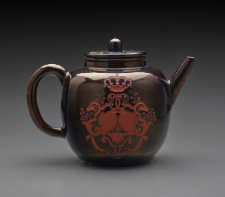 black-glazed teapot with etched decoration
