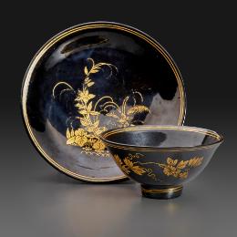 tea bowl and saucer with black glaze and gold