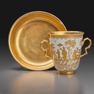 tea cup and saucer with gold decoration