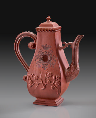 tall red teapot with four sides