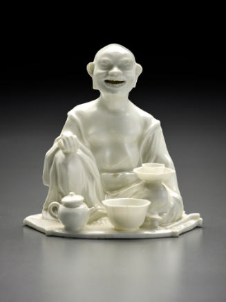 White incense burner in the shape of a seated Buddhist divinity
