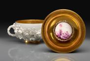 bowl with two handles and elaborate floral relief decoration, opened