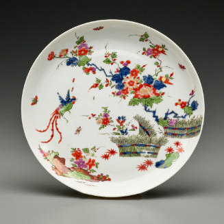 dish with scene containing bird and flowers with baskets
