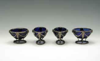 Photograph of four blue bowls with silver mounts