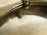 Close-up photograph of engraving on silver bowl