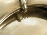 Close-up photograph of engraving on silver bowl