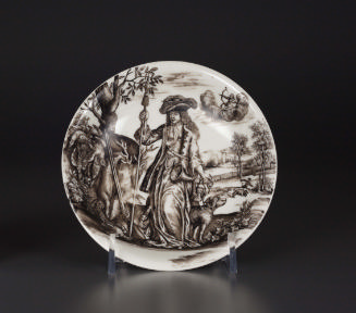 Saucer with painted figure at the center and a landscape in the background