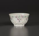 Tea bowl with floral relief and painted decorative motif