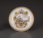 Saucer with painted landscape and gilt decoration