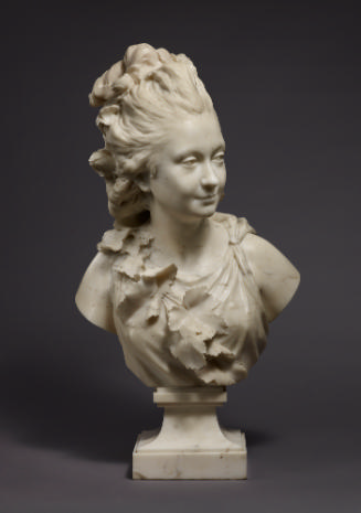 Marble sculpture of the Comtesse du Cayla.  Her windswept hair is gathered at the top of her he…