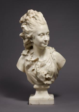 Marble sculpture of the Comtesse du Cayla.  Her windswept hair is gathered at the top of her he…