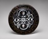 Back view of black painted enamel dish with Jupiter on a chariot