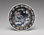 Black painted enamel dish depicting Saturn on a chariot