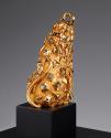 Back view of gold seated lion with scattered diamonds and enamel