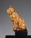Alternate view of gold seated lion with scattered diamonds and enamel