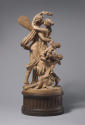 Back view of a terracotta sculpture of Zephyrus and Flora.  The two figures are sharing a kiss,…