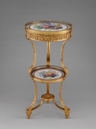 View of tripod table from the side made with two circular plaques of Sevres porcelain held toge…