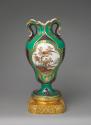 Porcelain vase with ear-like forms and with images of birds in trees on a gilt bronze base