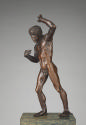 Bronze sculpture of a naked youth with raised left arm