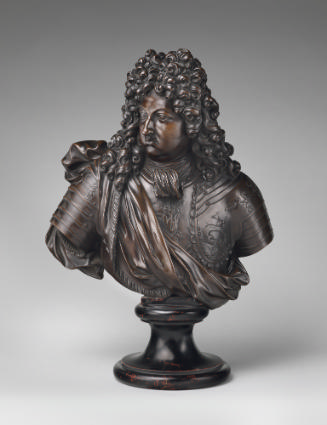Bronze sculpture of the bust of a man with curled hair